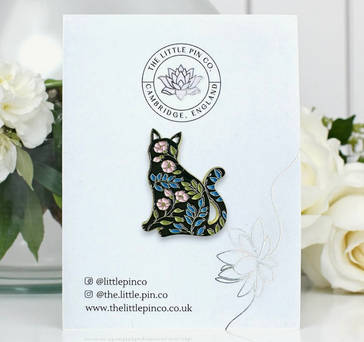 The little pin company “black cat with flowers” pin
